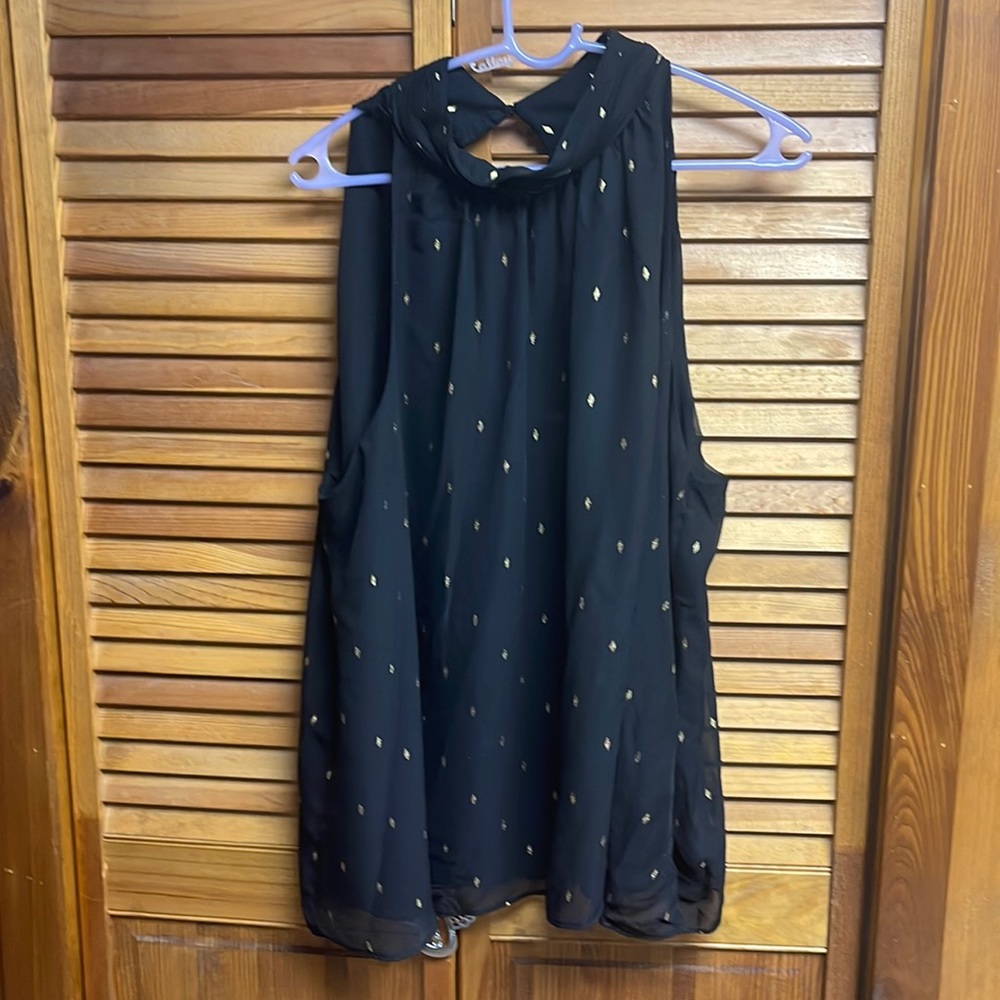 Sleeveless black tank top with gold diamonds